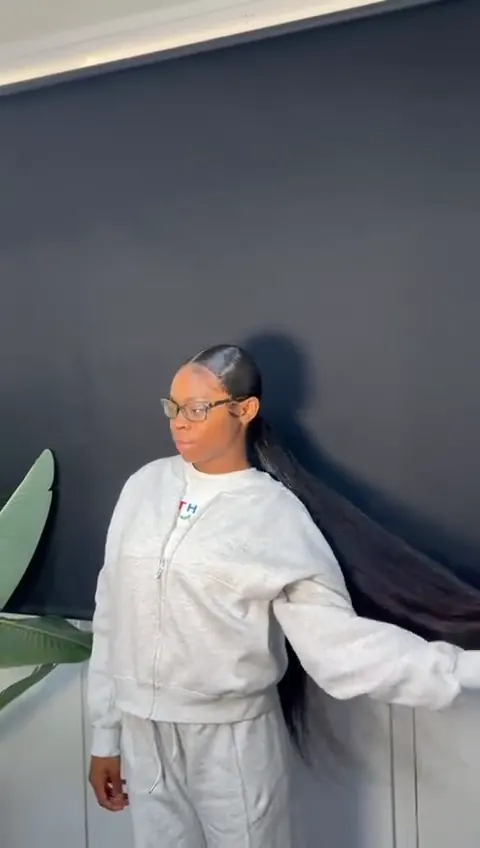 Very long sleek ponytail swinging as the client turns